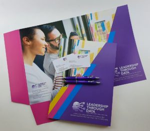 Printed presentation folders, business cards and promotional pens for Leadership Through Data.