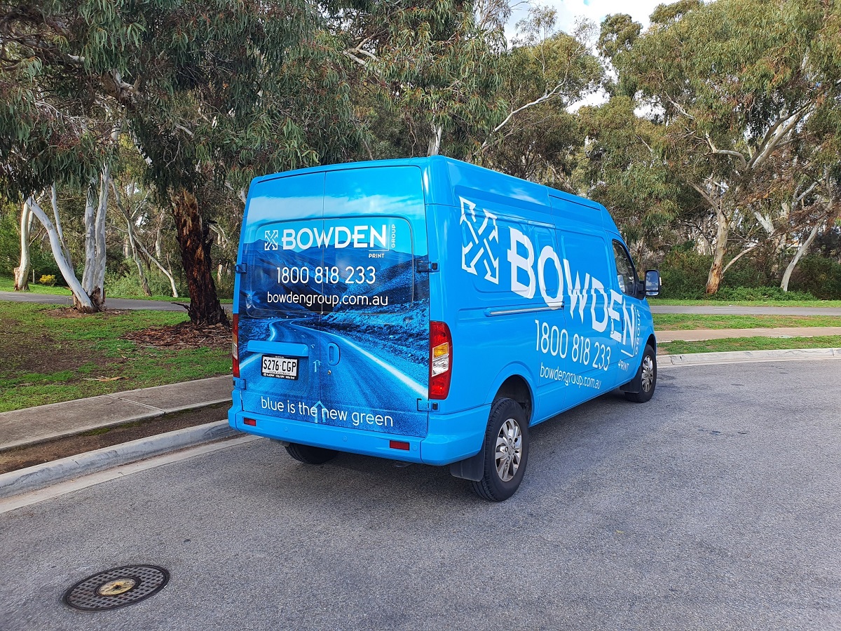 Rear quarter view of Bowden Print Group delivery van wrap design